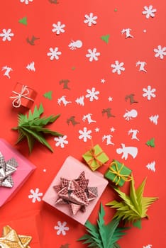 Christmas or New Year background, plain composition made of Xmas decorations and fir branches, flat lay, blank space for a greeting text.