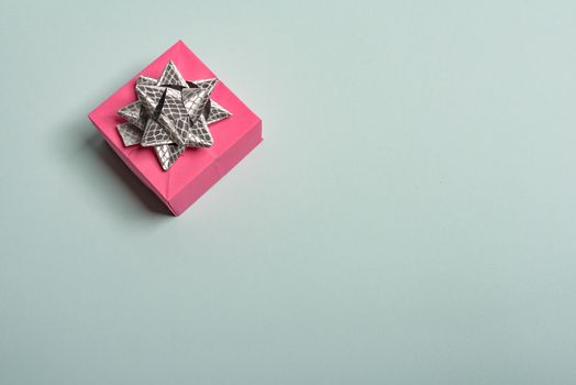 christmas presents nicely decorated with bows and feathers. view from above
