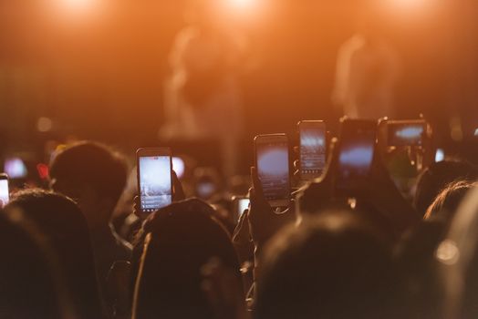 Event people live video festival music concert by hand holding smart mobile phone