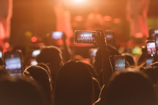 Event people live video festival music concert by hand holding smart mobile phone