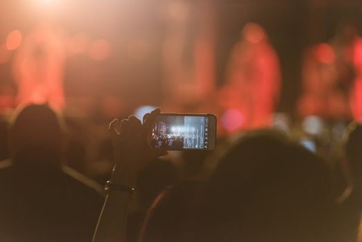 Event people live video festival music concert by hand holding smart mobile phone