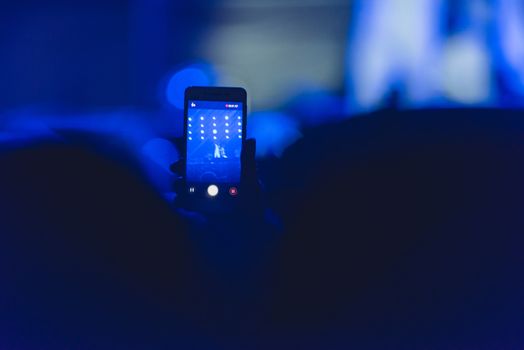 Event people live video festival music concert by hand holding smart mobile phone