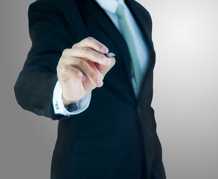 Businessman standing posture hand hold a pen isolated on over gray background