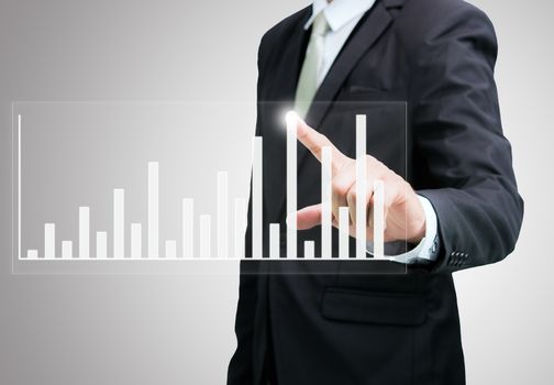 Businessman standing posture hand touch graph finance isolated on over gray background