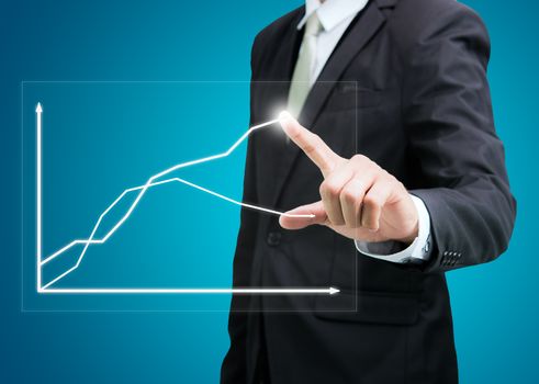 Businessman standing posture hand touch graph finance isolated on over blue background