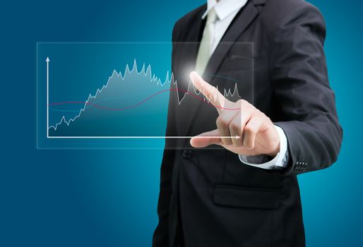 Businessman standing posture hand touch graph finance isolated on over blue background