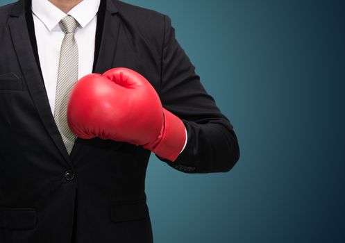 Businessman standing posture in boxing gloves isolated on over blue background