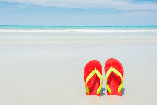 Beach, slippers on tropical beach in holiday at Thailand