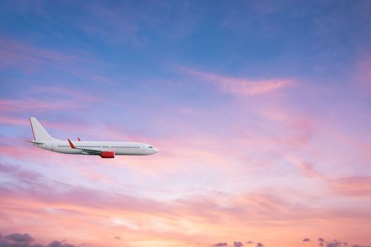 Airplane plane in the sky at sunset sky