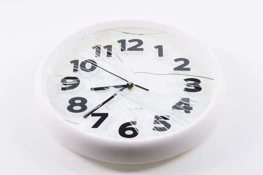 White clock is broken glass isolated on white background