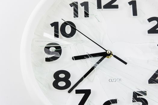 White clock is broken glass isolated on white background