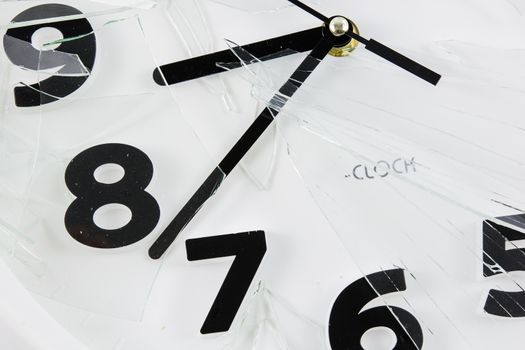 White clock is broken glass isolated on white background