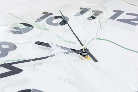 White clock is broken glass isolated on white background