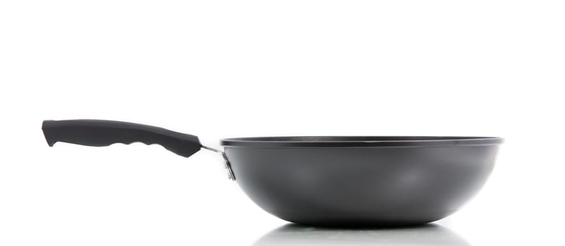 Closeup black frying pan isolated on over white background