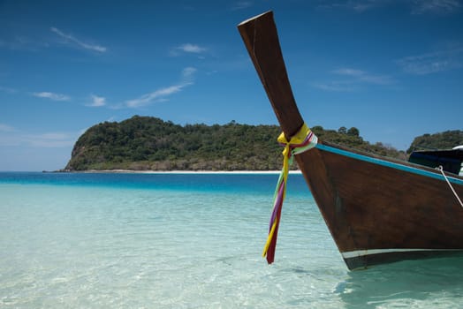 Long tailed boat on the sand beach at KohRook island south of Thailand