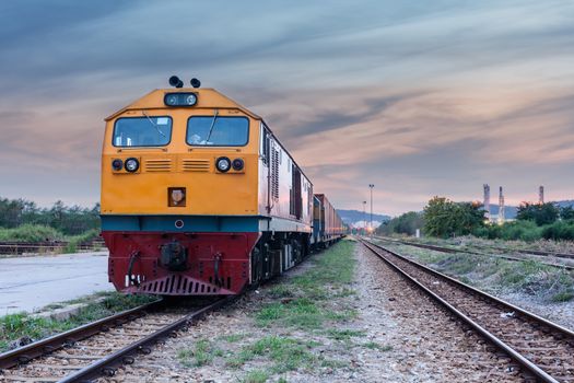 Cargo train and container at twilight of Thailand