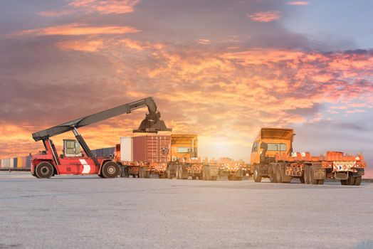 Forklift handling container box loading at the Docks with Truck