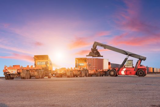 Forklift handling container box loading at the Docks with Truck