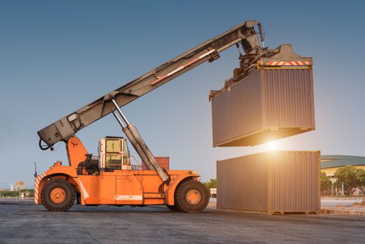 forklift handling holding container box at harbor logistic zone