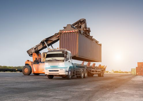 Forklift handling container box loading at the Docks with Truck