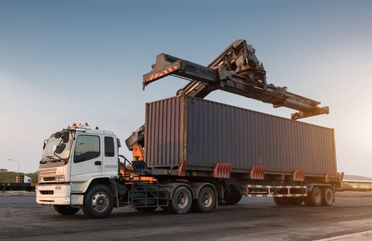 Forklift handling container box loading at the Docks to Truck