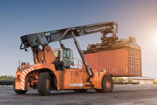 Forklift handling container box loading at the Docks with Truck