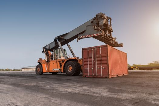 Forklift handling container box loading at the Docks with Truck