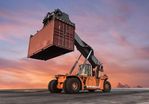 Forklift handling container box loading at the Docks with Truck