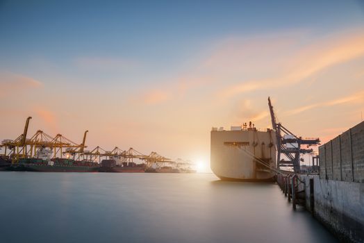 Cargo or Trade Shipping Port at sunrise