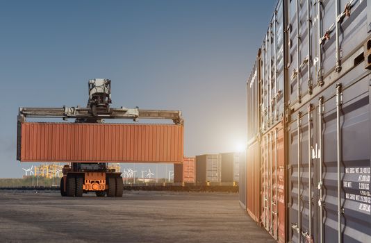 forklift handling container box loading from dock to truck