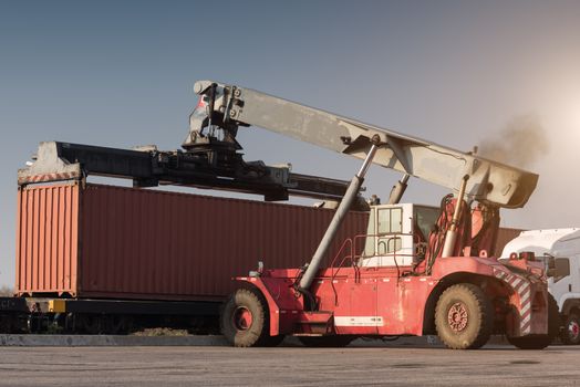 forklift handling container box loading from dock to truck