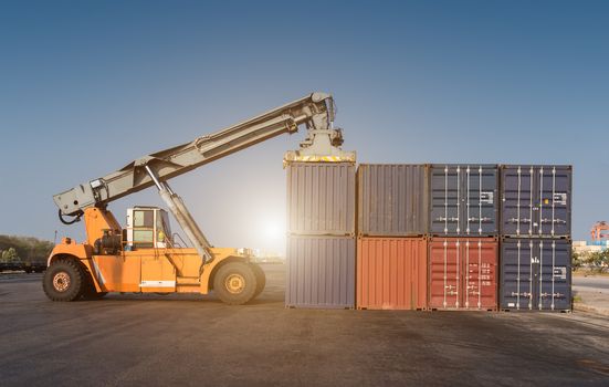 Forklift handling the containers box in the port at Thailand