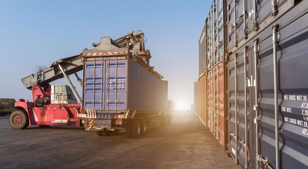 Forklift handling the containers box in the port at Thailand