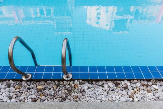 Hotel blue swimming pool with stair for relaxation