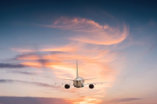 Airplane aft plane in the sky at sunset sky