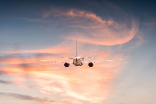 Airplane aft plane in the sky at sunset sky