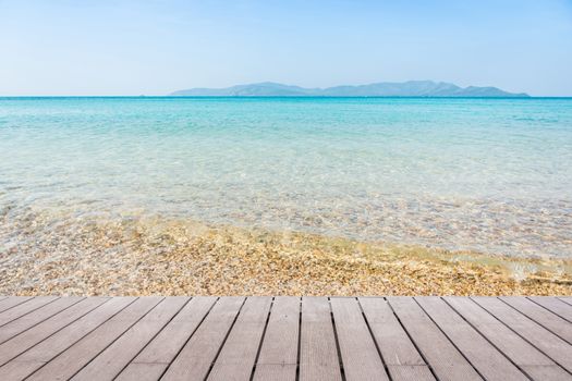 Beach Scene With Wooden Floor background can put or montage your products