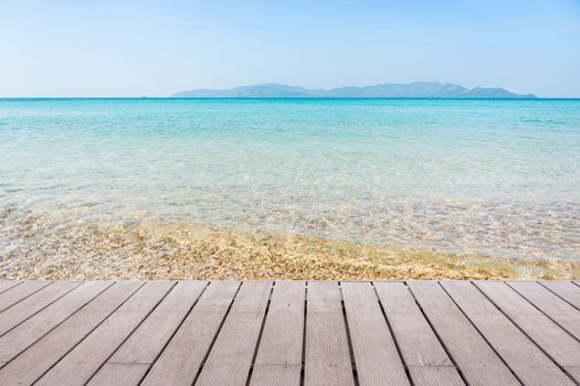 Beach Scene With Wooden Floor background can put or montage your products