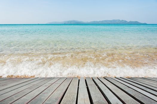 Beach Scene With Wooden Floor background can put or montage your products