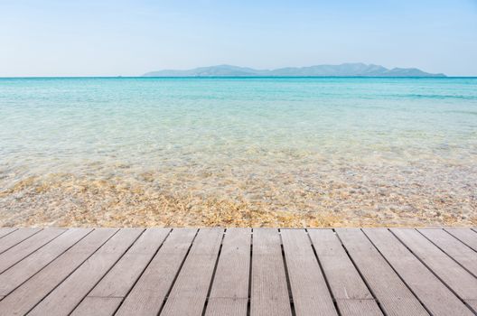 Beach Scene With Wooden Floor background can put or montage your products