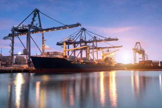 Container ship in the harbor at sunrise
