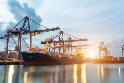 Container ship in the harbor at sunrise