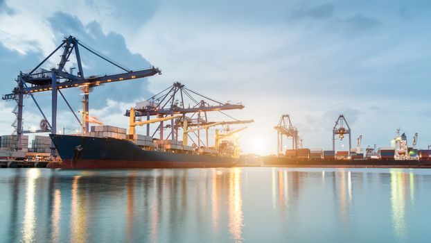 Container ship in the harbor at sunrise