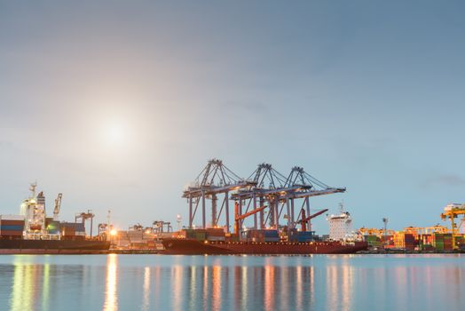 Container Cargo freight ship by crane bridge, logistics harbor at sunrise