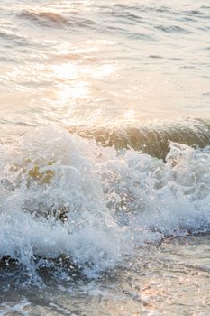 Wave of the sea sunset on sand beach