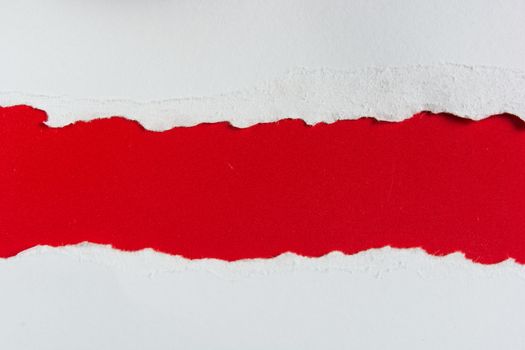 tear red paper pieces of paper on white background