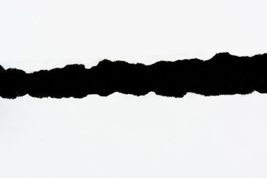 tear white paper pieces of paper on black background