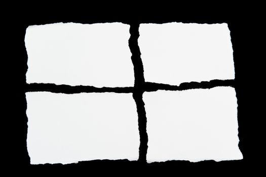 tear white paper pieces of paper on black background