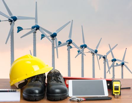 Working table engineer with tablet and tools in building construction crane