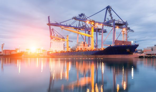 Containers loading Shipping by crane at morning or Trade Port